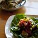 A summer tomato salad with butter lettuce and pesto vinagriatte sits on a table with a dish of  Bigoli with snails, Fava beans, artichokes, and black garlic. Daniel Brenner I AnnArbor.com